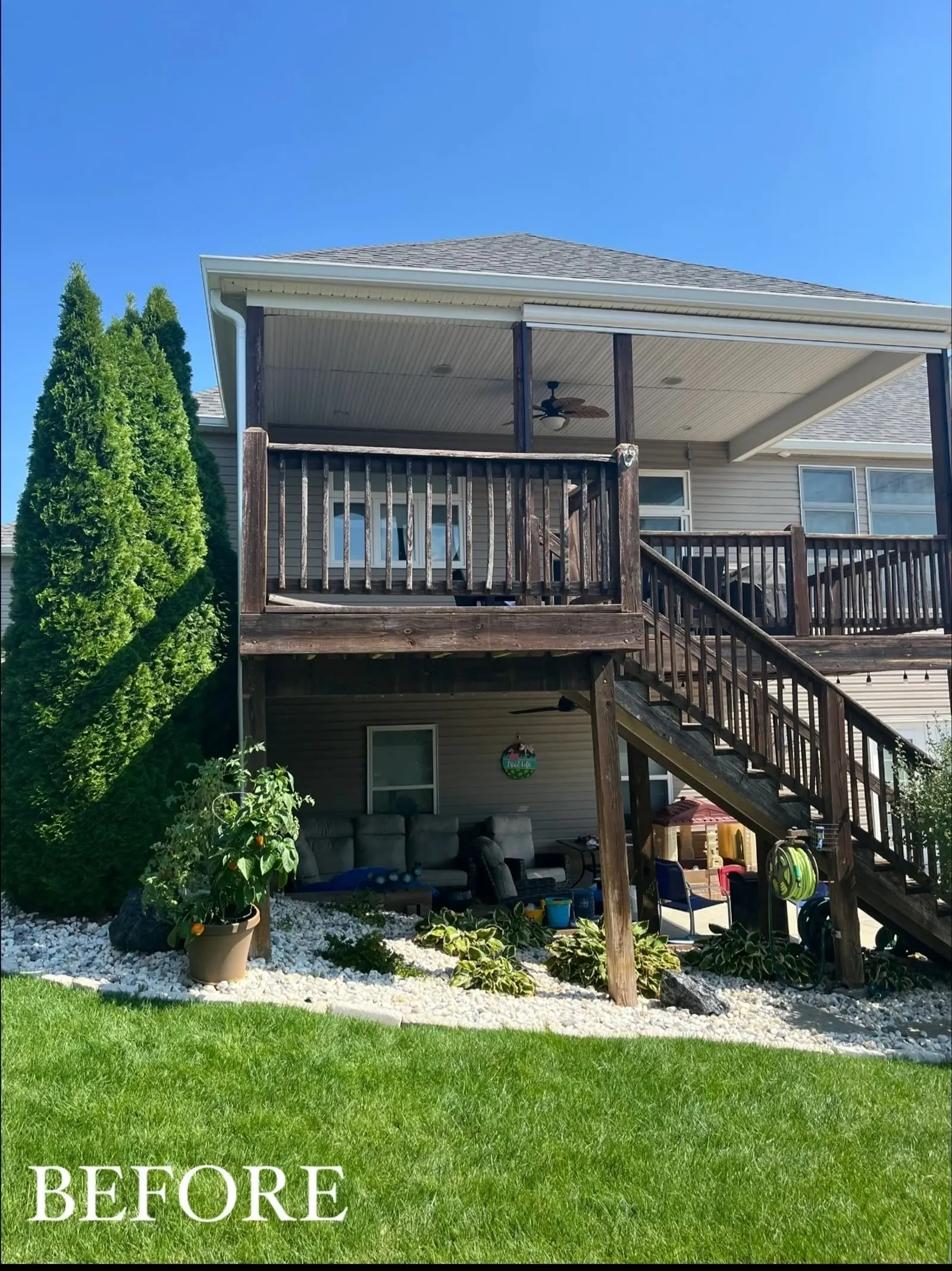 Elevated covered deck with black aluminum railing and stairs built by MDR Build in Greater St. Louis, MO